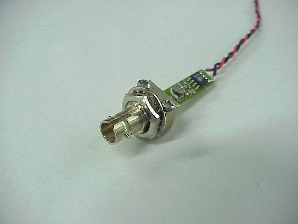 This assembly contain Class 1 Red laser diode, fiber optic coupler and driver plate.