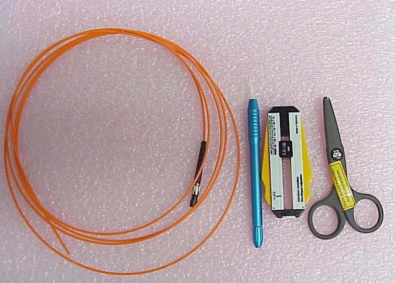 Appendix: 1 Stripping, cleaving of the fiber optics and introducing into the Hand piece Follow the following steps : Open the accessory box and pick: fiber stripper, hand piece, fiber cleaver and a