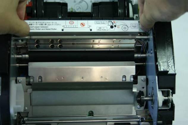 Paper jam during rewinding (rewind feed). Please check the paper and re-start the printer. Abnormal paper cutting. * Please re-start a printer.