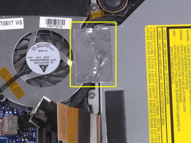 Lift the foil tape from the fan side, leaving it attached to the optical drive.