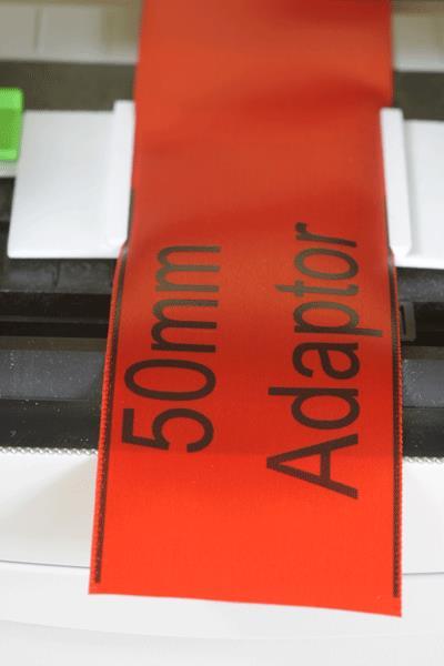 The superior tracking of the Express printer is evident in the image below where a border has been printed on 50mm ribbon. Long Life The Express printer is a Centre feed printer.