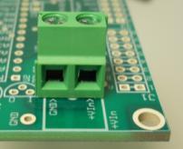 Flip the board over and solder pin 1 first. Then solder pin 21. You now have one pin at each corner soldered.