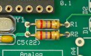Note that the silkscreen for all polarized electrolytic capacitors show a + sign on the board and the positive hole is pin 1 of the capacitor indicated by a square solder pad.