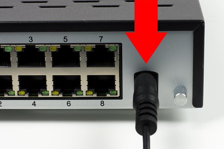6. Connect the NVR power cable into the back of the NVR, and