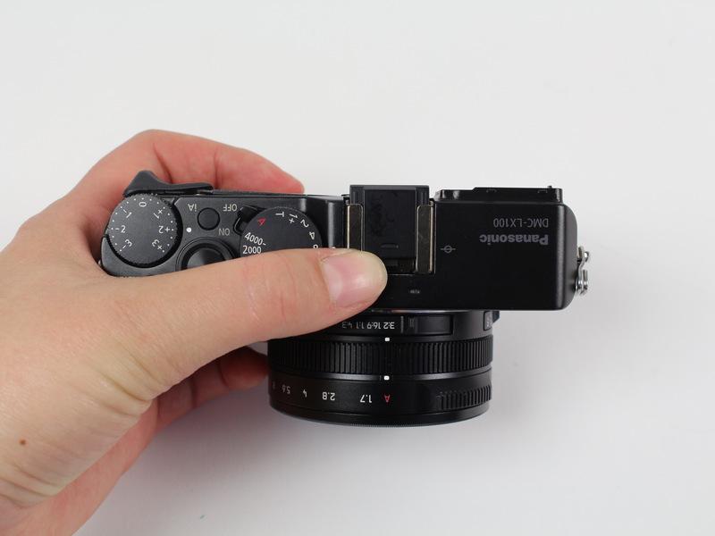 Pull the black plastic piece off of the viewfinder.