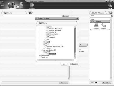 Transferring camera images to the computer Select where to save the images. The Transfer Images window and a dialog box for selecting the folder to which to save the images are displayed.