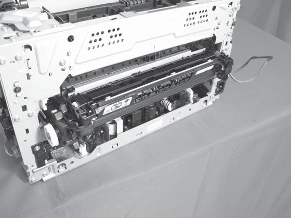 5. Pull the ITB assembly (callout ) straight out of the product. CAUTION: Avoid touching the black plastic transfer belt.