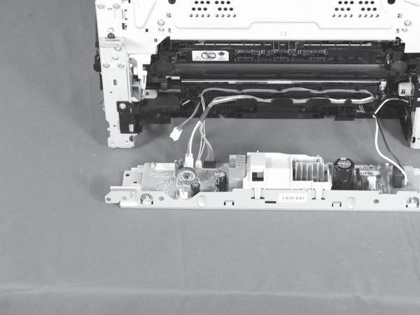 Disconnect three connectors (callout ) and remove the low-voltage power supply assembly (callout 2).