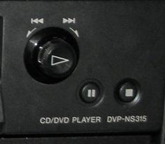 (3) DVD PLAYER Select the DVD input on the Touch Remote. To turn on the DVD Player, press the BUTTON which is located on the front of the device.