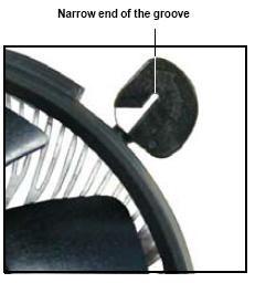 The narrow end of the groove should point outward after resetting.