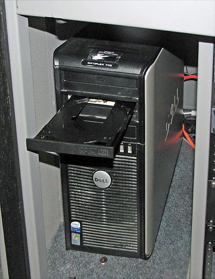 Using a DVD or CD The computer has two DVD/CD drives, located at the top of the CPU cabinet inside the podium. HOWEVER, THE TOP DRIVE DOES NOT WORK AT THIS TIME (10/2014).