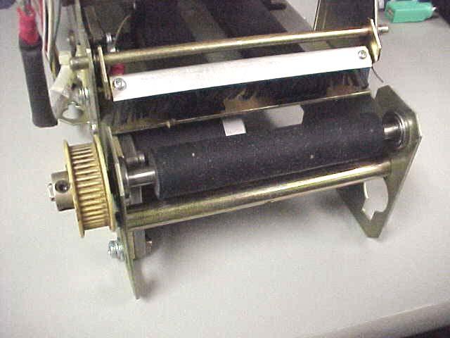 Unimark 8500 Bag Tag Printer 13 Loosen both set screws securing the gear to the platen.