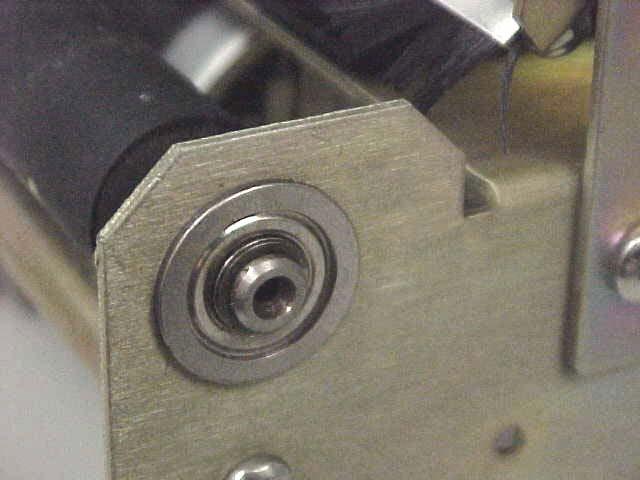 two set screws is tightened against a flat side of the end of the platen.
