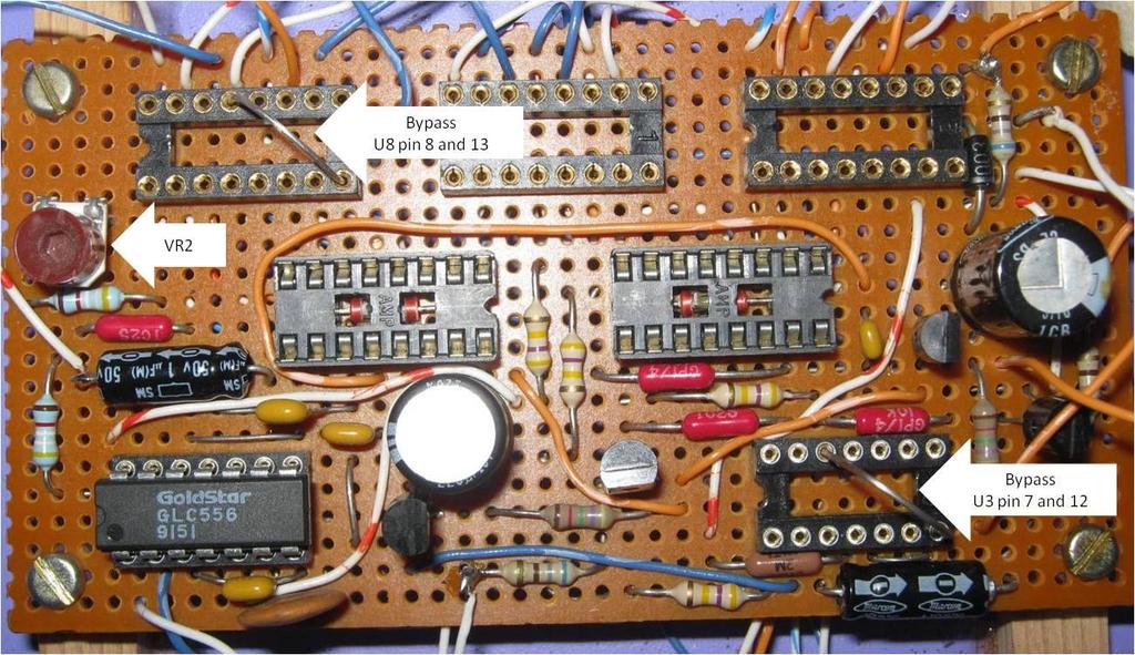 Disconnect the power supply and insert U2 (LM556). Do not insert U3 through U8. Use a bypass lead to connect between pin 7 (GND) and pin 12 (Q-bar) of U3 socket.