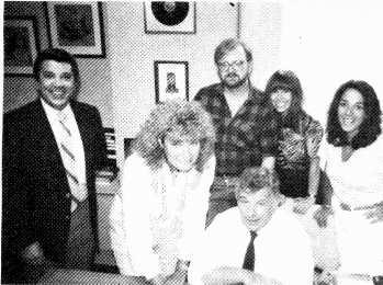 www.americanradiohistory.com Signing Sylvia. New York Music Co. president Sid Bernstein, seated, signs Sylvia Bennett to the label. Her first release is the 12 -inch single "You're My Fantasy.