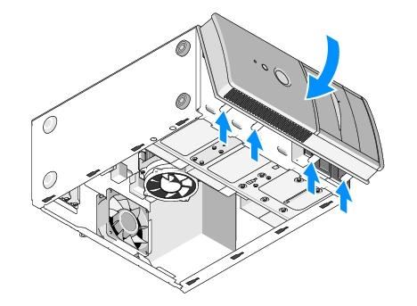 1. With the computer still on its side, align and insert the bezel hooks into the slots along one edge of the front of the computer. 2.