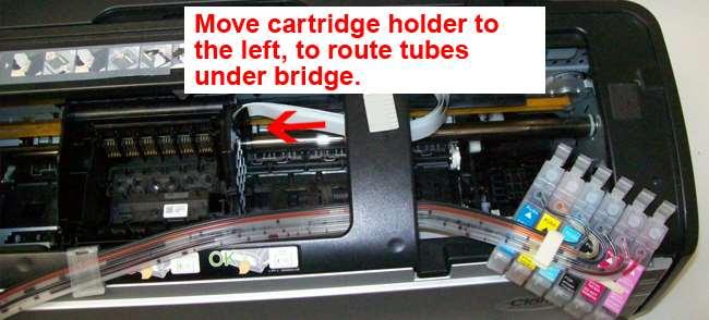 6. Install cartridge, attach square clip to printer and route tubes : Before installing the cartridges, we suggest placing the CIS's tubes under the plastic bridge so the printer head can move