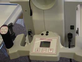 3. Attach the new computer bracket to the quilting machine using the handlebar bolts in the same way the previous