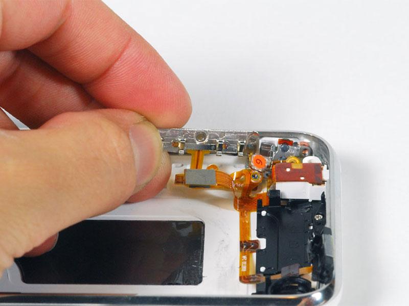 Step 21 Lift the volume button circuitry away from the side of the iphone, and carefully peel up the orange ribbon