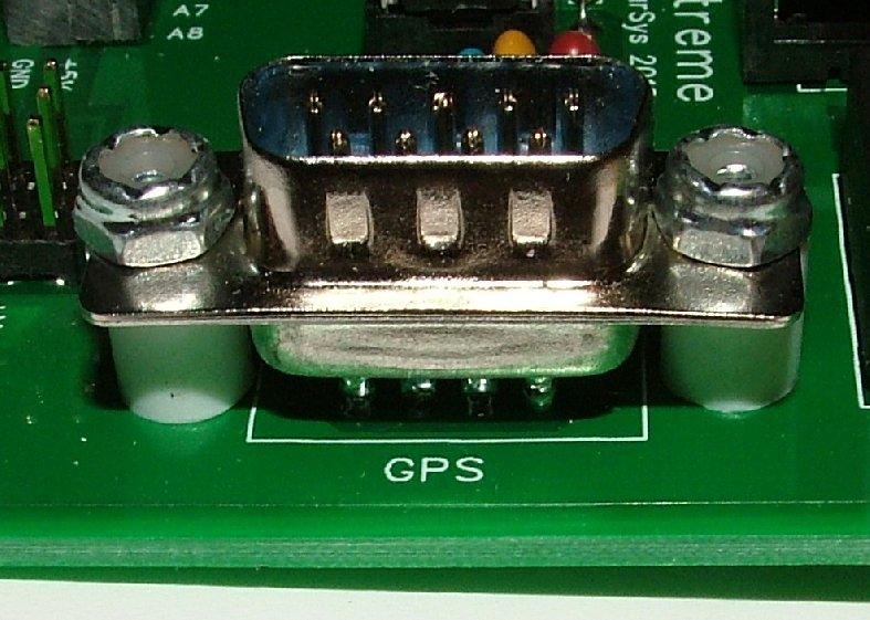 After prepping the DB-9 (or using a DB-9 with pins on the back), insert the DB-9 into the PCB. The male DB-9 is soldered to the GPS Port and the female DB-9 is soldered to the PGM Port.