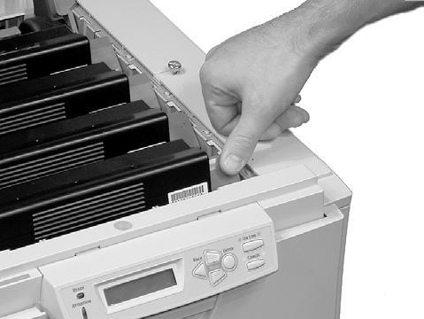 8. Lower the right end of the cartridge into the image drum unit. Press it firmly down in place. Then, push the colored lock lever back to open the toner slot and lock it in place.