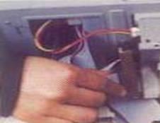 Set the jumpers to make the drive a master or slave device. The jumpers are located on the back of the drive (Figure 15).