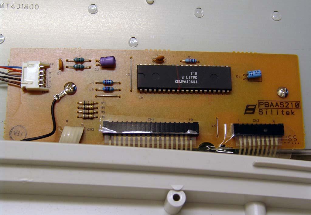 As well as the LED panel, there s another little circuit board. The date code on the IC probably means 1997 week 18. The cable to the LED panel plugs in to the left of the picture.