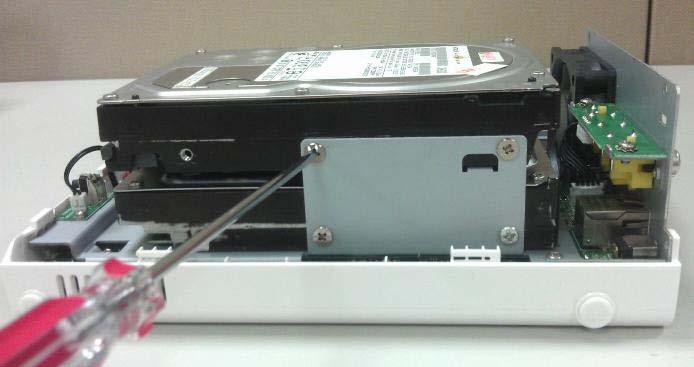 Secure the HDD with the screws provided in the accessory box with a