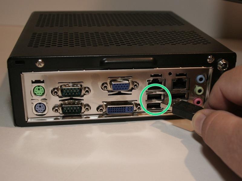 If you have a DVI cable (not shown), connect it in the location directly below the VGA cable.