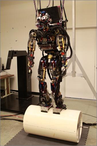 Figure 2.7. Experimental setup on the Sarcos humanoid robot. required in computing the joint torques.