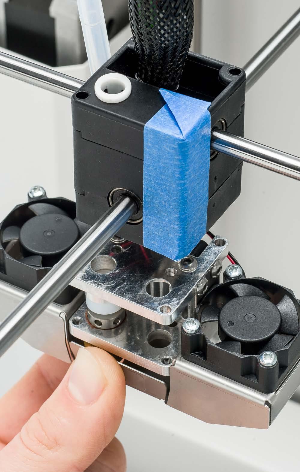 Put some blue tape around the three parts of the print head housing.