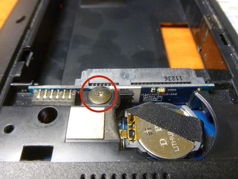 Step 14 On the bottom of the laptop, remove this screw, then lift the left side
