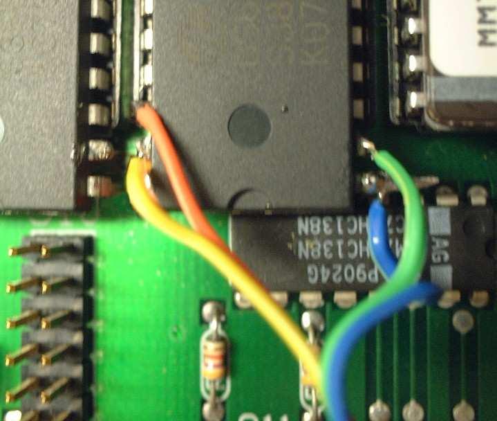 1) Remove chip 1 from the socket. Solder 3 lengths of blue, green, yellow, and orange wires to the top of the shoulders of chip 1 s pins 1,, 30 and 31.