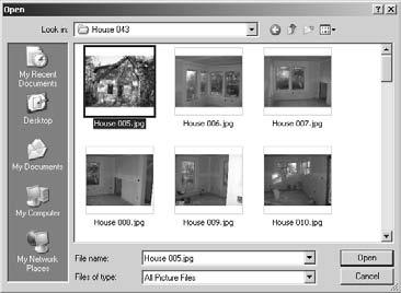 6), select it, and click Open. A pretty picture of my house is shown in the Paint window in Figure 3-