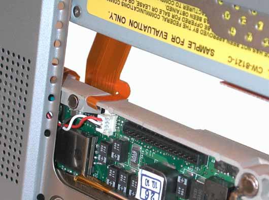 When installing the replacement drive, ensure that the flex cable folds over the rib