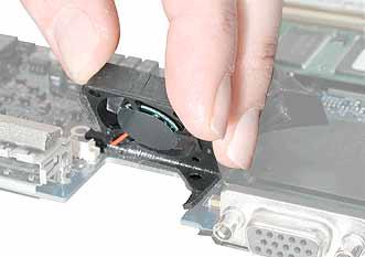 3. Turn over the logic board, and tilt up the fan to remove it completely from the logic board.