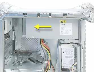 5. Slide the power supply forward and remove the power supply and cable harness from the