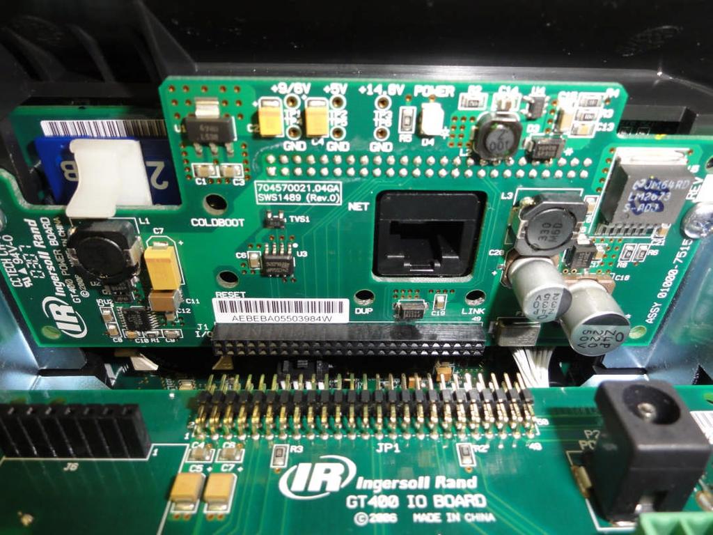 Removal of the IO board With the terminal still laying face down and while wearing the ESD