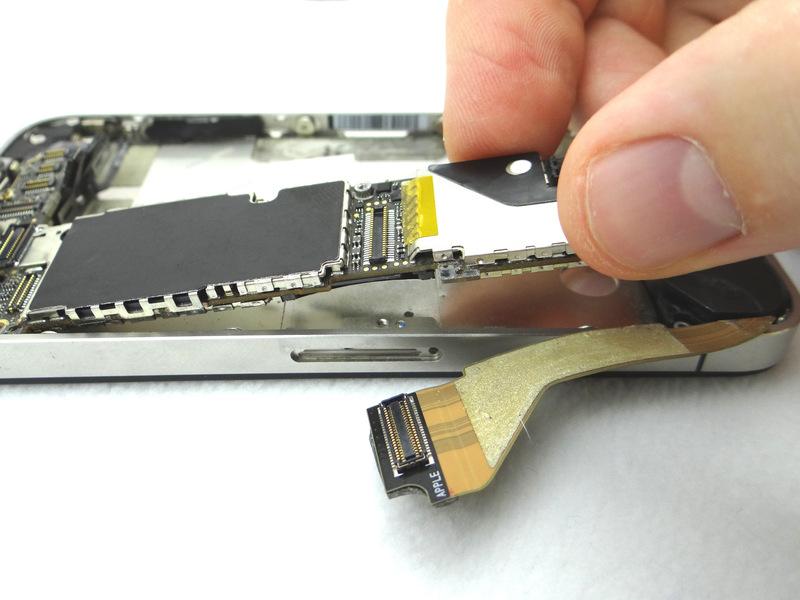 Step 13 Picture 1: Carefully lift the logic board just high enough to pinch it with your left thumb and index finger.