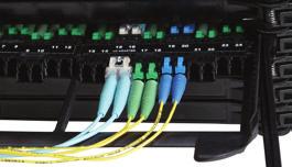 The multi-fiber cable exiting the back side of the module would then route to a splice vault or secured in a tie panel or IFC cable configuration for outside plant applications.