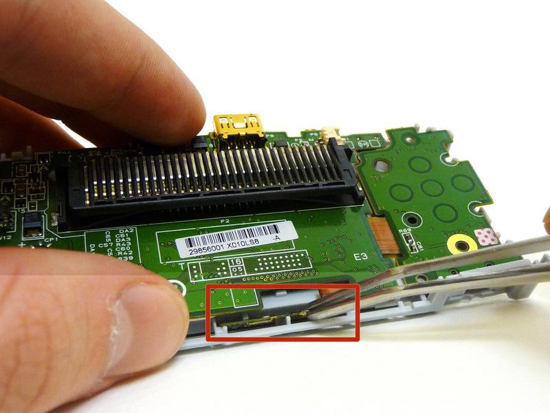The LCD screen is attached to the motherboard by a