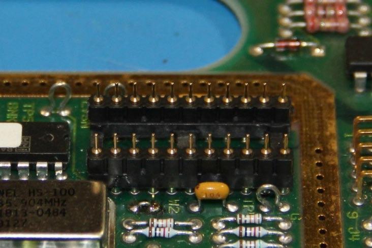 Insert the strip pins to the DIP socket. Make sure the pins are fully inserted and the plastic strips sit flat on top of the IC socket, with shouldered pins on top.