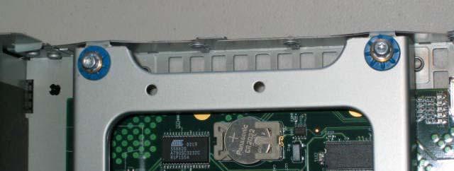 Using your Torx T15 L-key (larger of the two, although either may work for these screws), unscrew and remove the two screws on the left-hand side of the drive bay (as you are looking at the front of