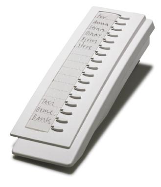 Pull-out board for number directory for mounting under the telephone.