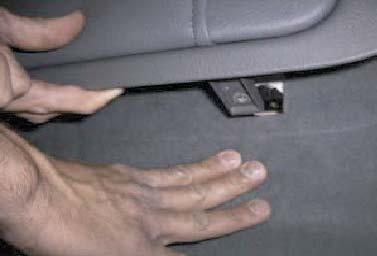 Pull out lower part of seat back to remove 2