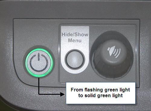 After pressing the Control Module Power Button, you should see the indicator ring light change from solid white to a flashing green which indicates that the projector is starting up.