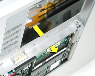 12. Open the display to 90-degrees and tilt the computer back so it rests on the back of the display. 13.