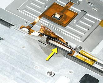 5. If replacing the existing keyboard, such as during a top case replacement, secure the end of the keyboard flex cable. (The cable inserts under the ZIF connector locking bar.) 6.