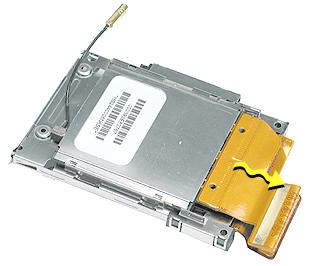 7. Turn over the PC card cage to locate the AirPort Extreme card. 8.