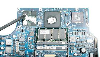 7. If the logic board was removed to facilitate another procedure and will be reinstalled, also remove all the thermal material from each of the three corresponding chips (shown below) in the same